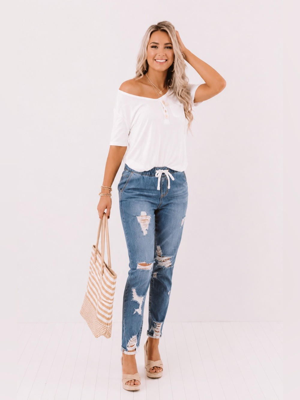 THE SABRINA HIGH WAIST DISTRESSED RELAXED SKINNY IN MEDIUM WASH